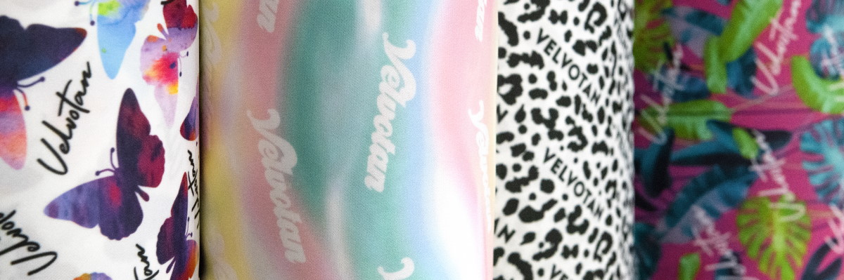 image: 4 tanning mitt designs side by side: butterflies, rainbow, leopard print, and leafy
