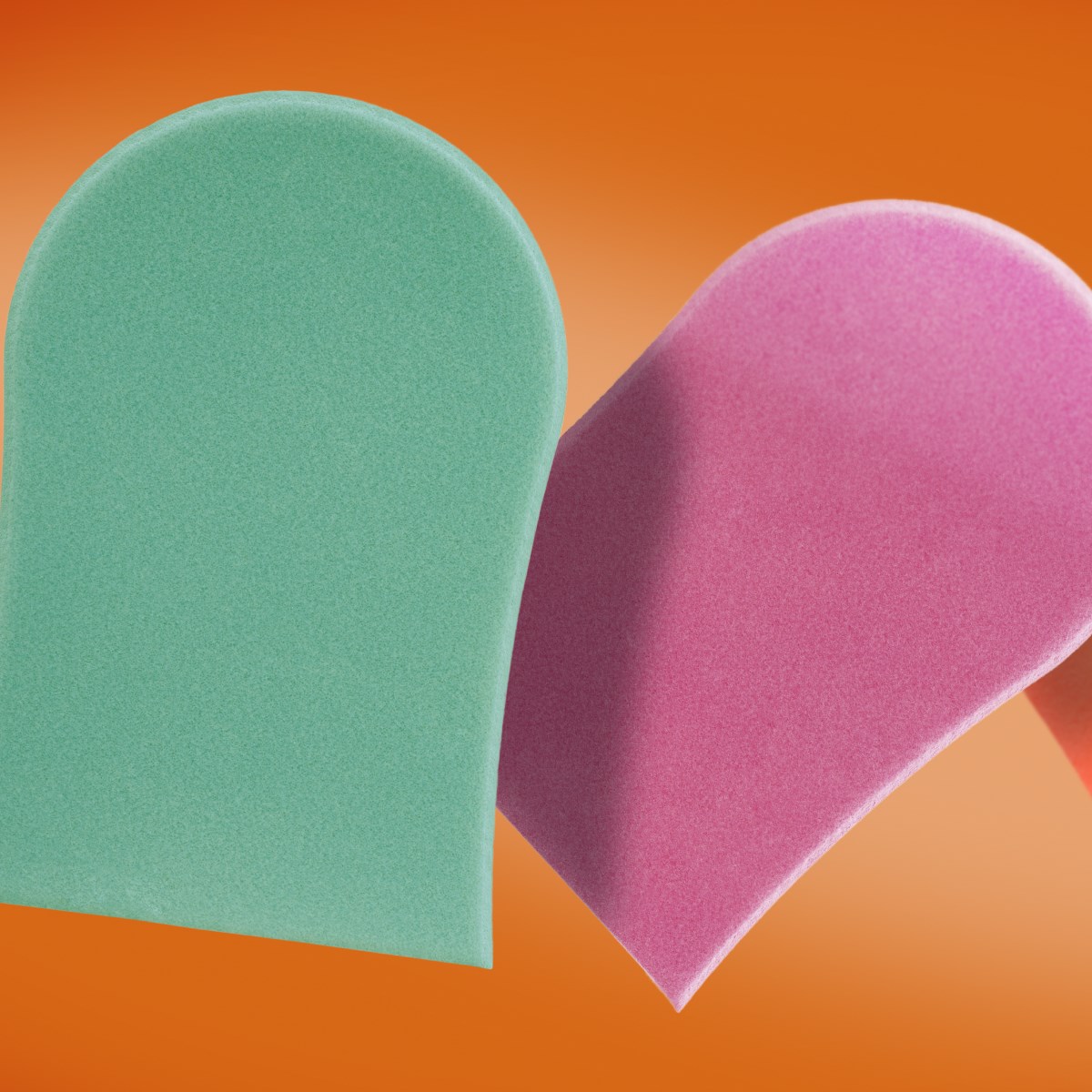 image: two tanning mitts on an orange background, one teal, one pink
